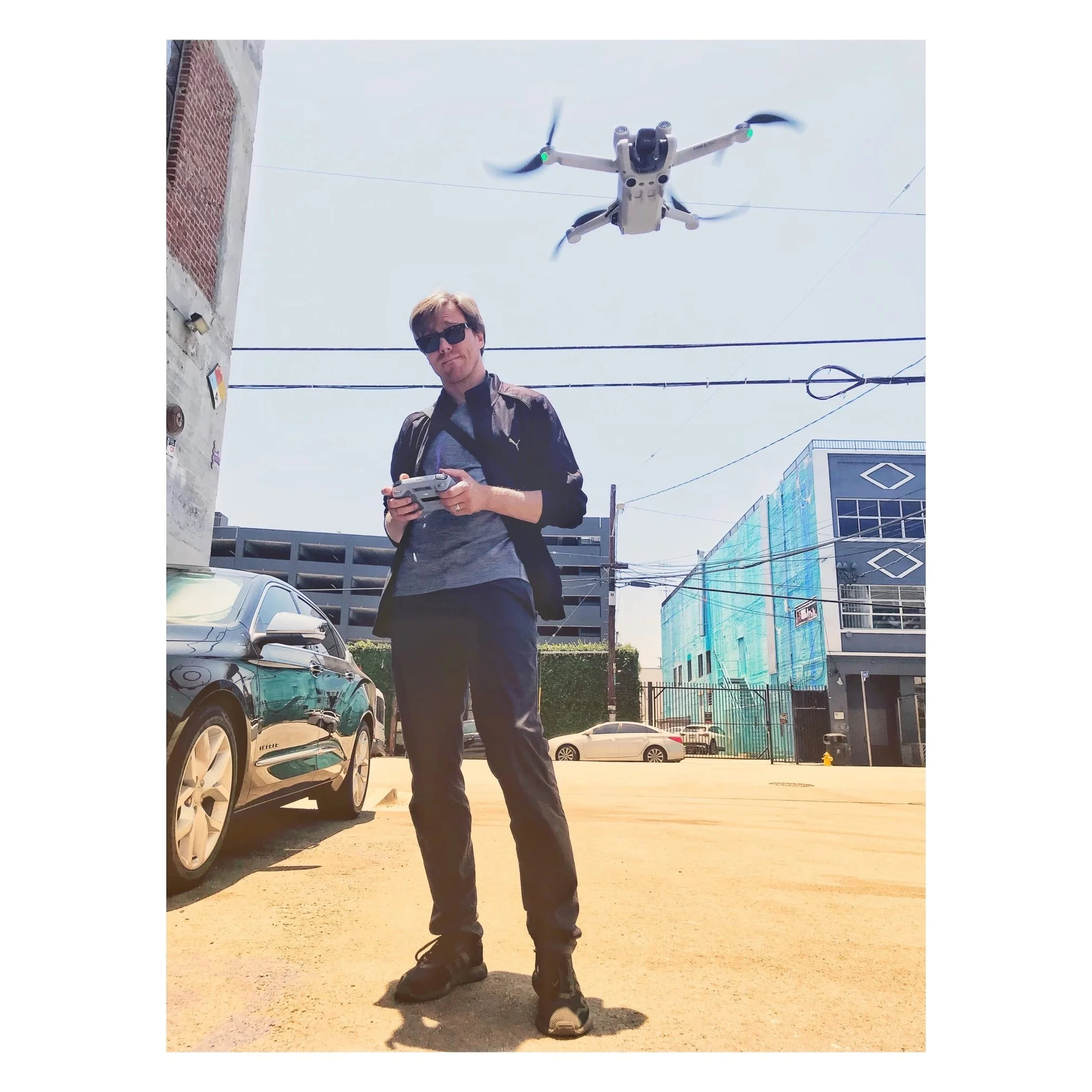 Sébastien Hameline operating a DJI drone on a Los Angeles street